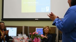 Volunteer Paola Stone congratulates graduates of Intel © Easy Steps computer skills course. The training was offered through a collaboration with Fresh Start Women’s Foundation and Goodwill Career Center in Chandler.